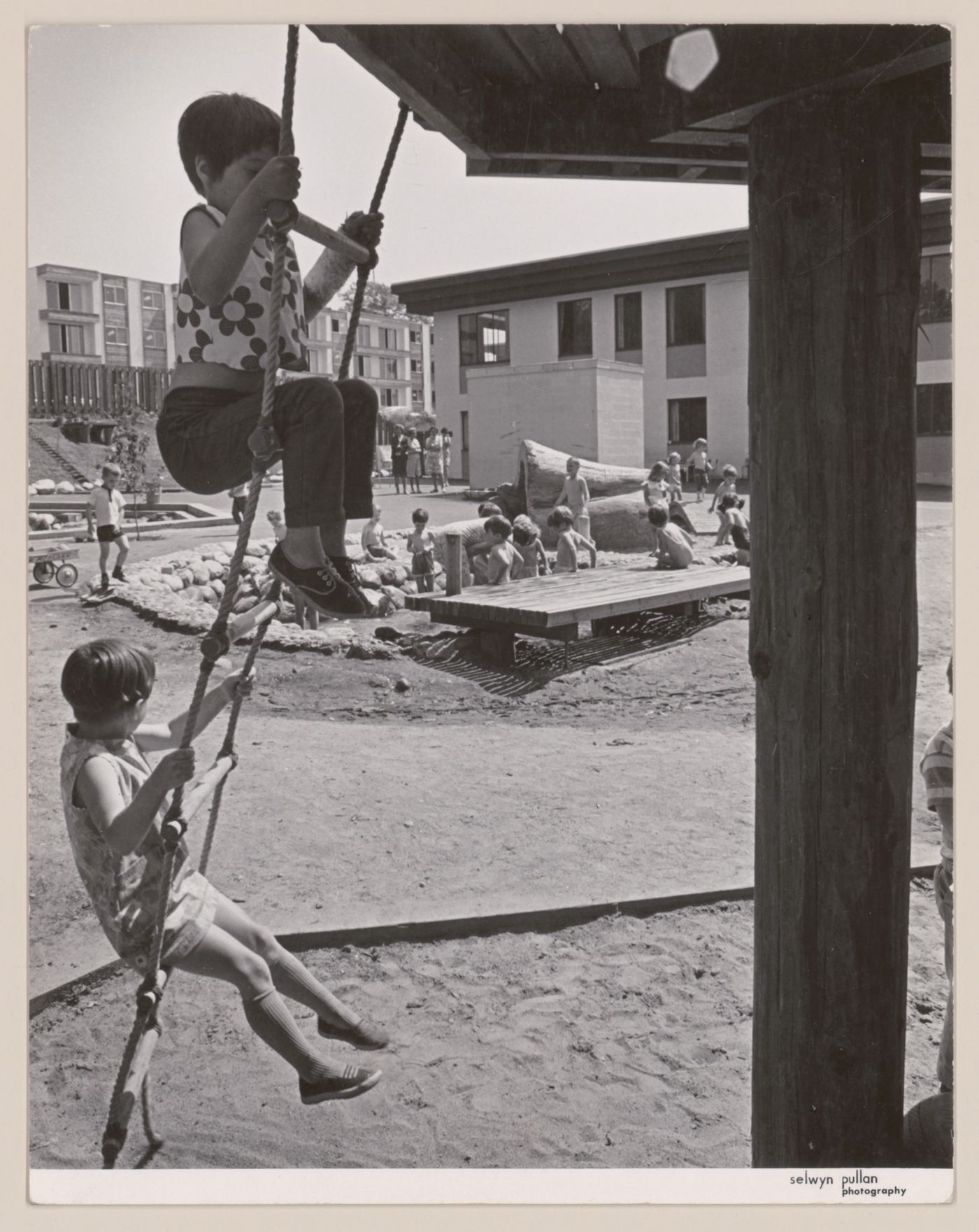 View of children playing in North Shore Neighbourhood House Playground, Vancouver, British Columbia