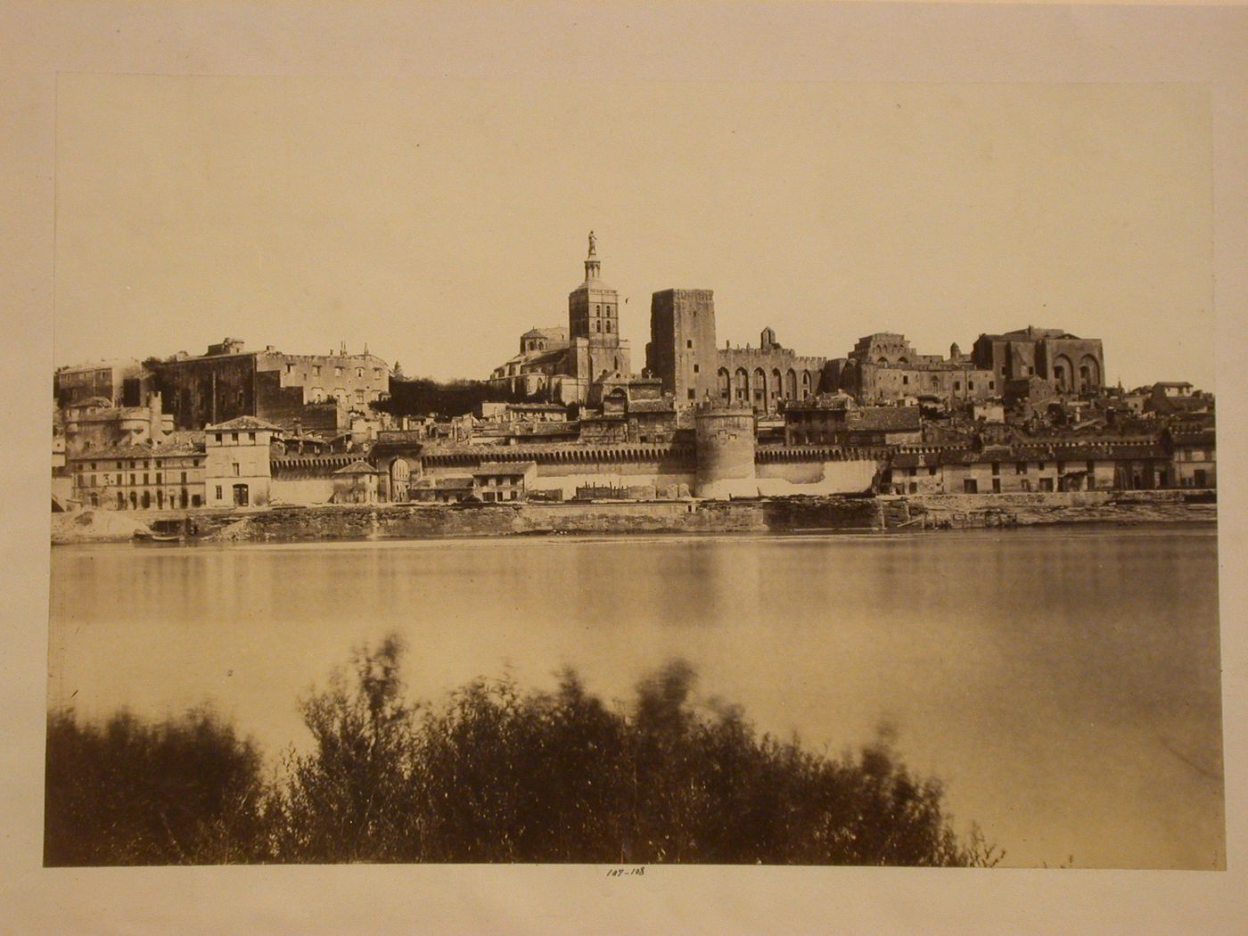 View across a bay showing coastal fortifications, Notre-Dame des Doms and the Palais des Papes, Avignon, France