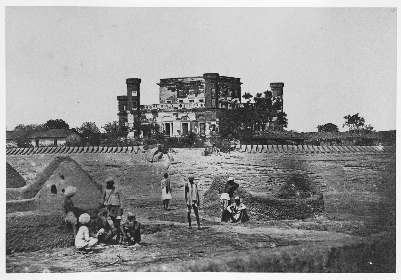 Distant view of the Khurshid Manzil [House of the Sun Palace] (now part of La Martinière College) showing fortifications in the foreground, Lucknow, India