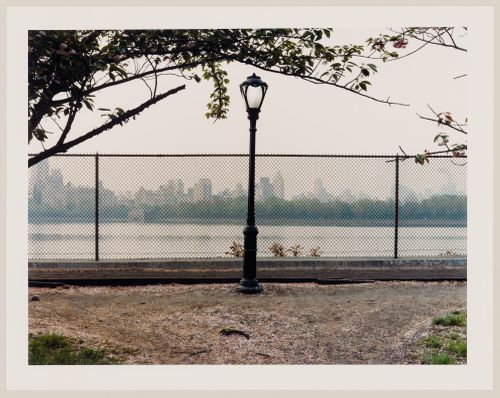 Viewing Olmsted: View of street light, fence and water, The Reservoir, Central Park, New York City, New York