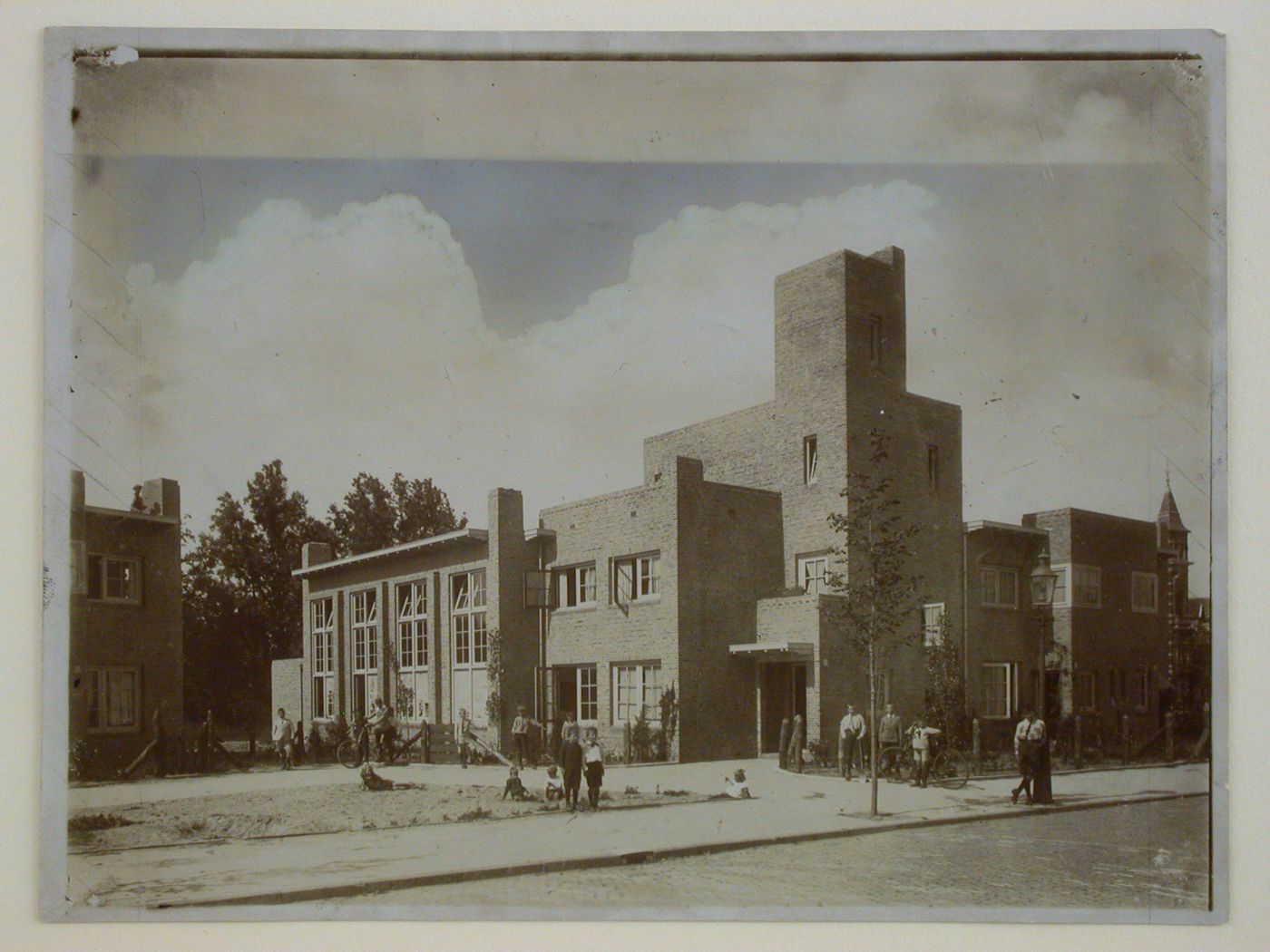 View of the Woningbauw [Housing Project] Rosehaghe with children posed in the foreground, Hoofmanstraat, Haarlem, Netherlands