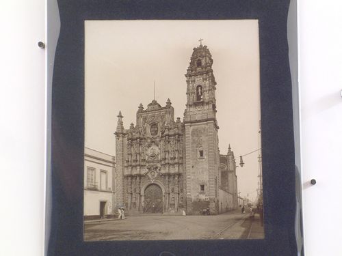 View of the principal façade of the Iglesia de la Santísima Trinidad with people throughout, Mexico City, Mexico