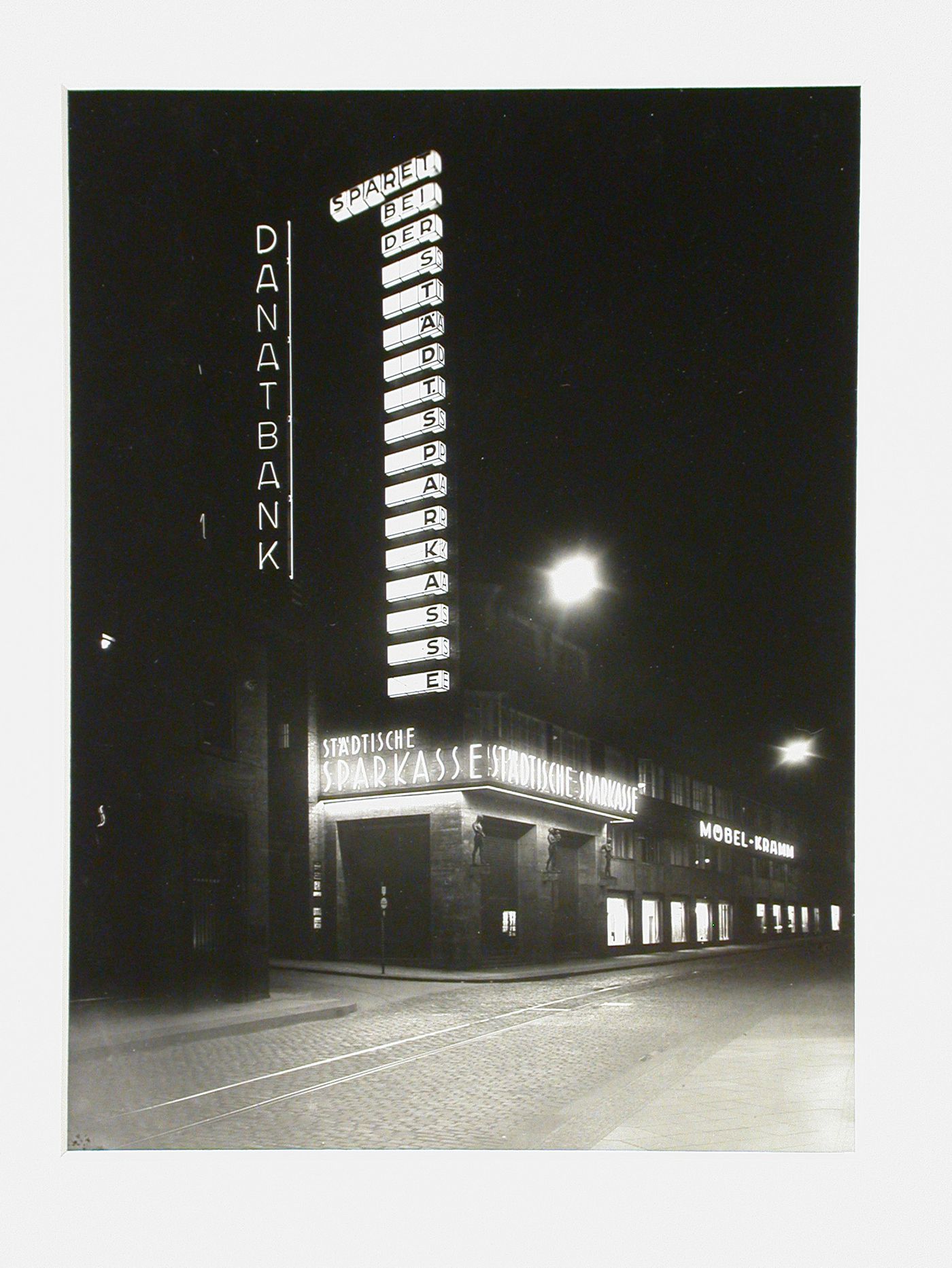 Illuminated night view of Städtische Sparkasse, Germany