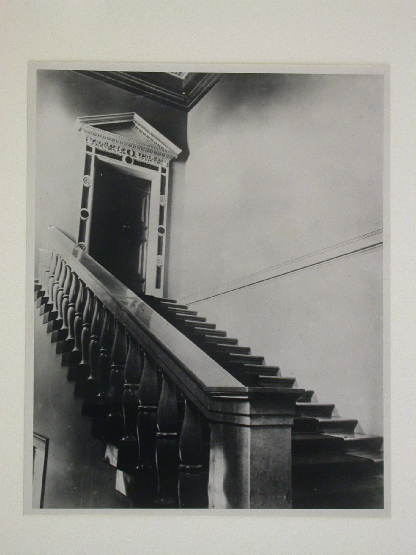 Interior view of the Tarasov Mansion showing stairs and a door with a decorated doorframe, Moscow