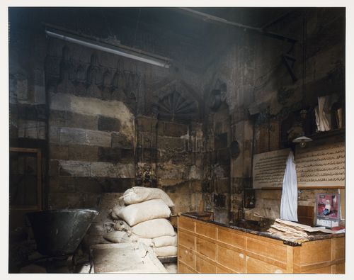 Madrasa of Qijmas al Ishaqi, interior view showing desk on right, bags of plaster and container on left, Cairo, Egypt