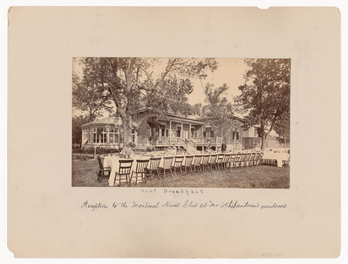 View of the garden and rear façade of Mille-Fleurs, the residence of the Honorable Mr. Thibaudeau, showing a table set for breakfast for the Montreal [sic] Hunt Club, Montréal [?], Québec
