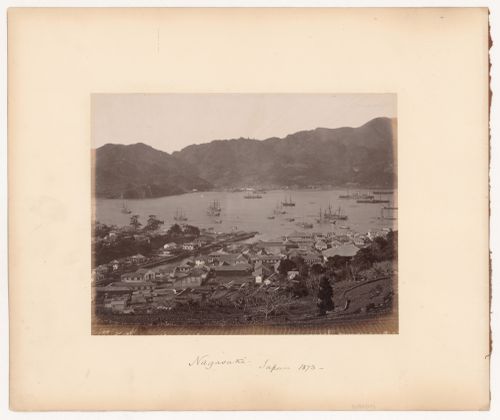 View of the harbour showing buildings at the waterfront and sailing vessels, Nagasaki, Japan