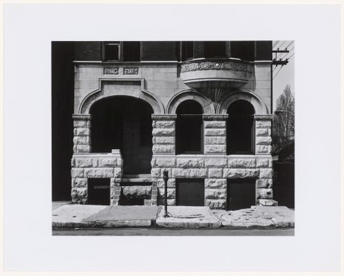 View of the ground floor of a deteriorating building showing carved stone details on the façade, North Avenue and Orchard Avenue, Chicago, Illinois, United States
