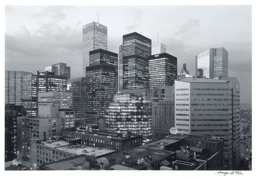 View of the banking district of Toronto at twilight showing the illuminated Commercial Union Tower, the Royal Trust Tower, the Toronto-Dominion Bank Tower and the IBM Tower