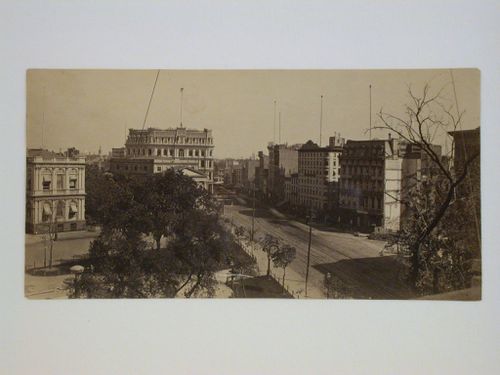 View looking down onto street with City Hall Park and side of City Hall, bottom left, Park Row, New York City, New York