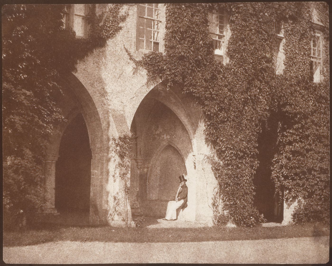 The Reverend Calvert R. Jones in the cloisters, Lacock Abbey, Wiltshire, England