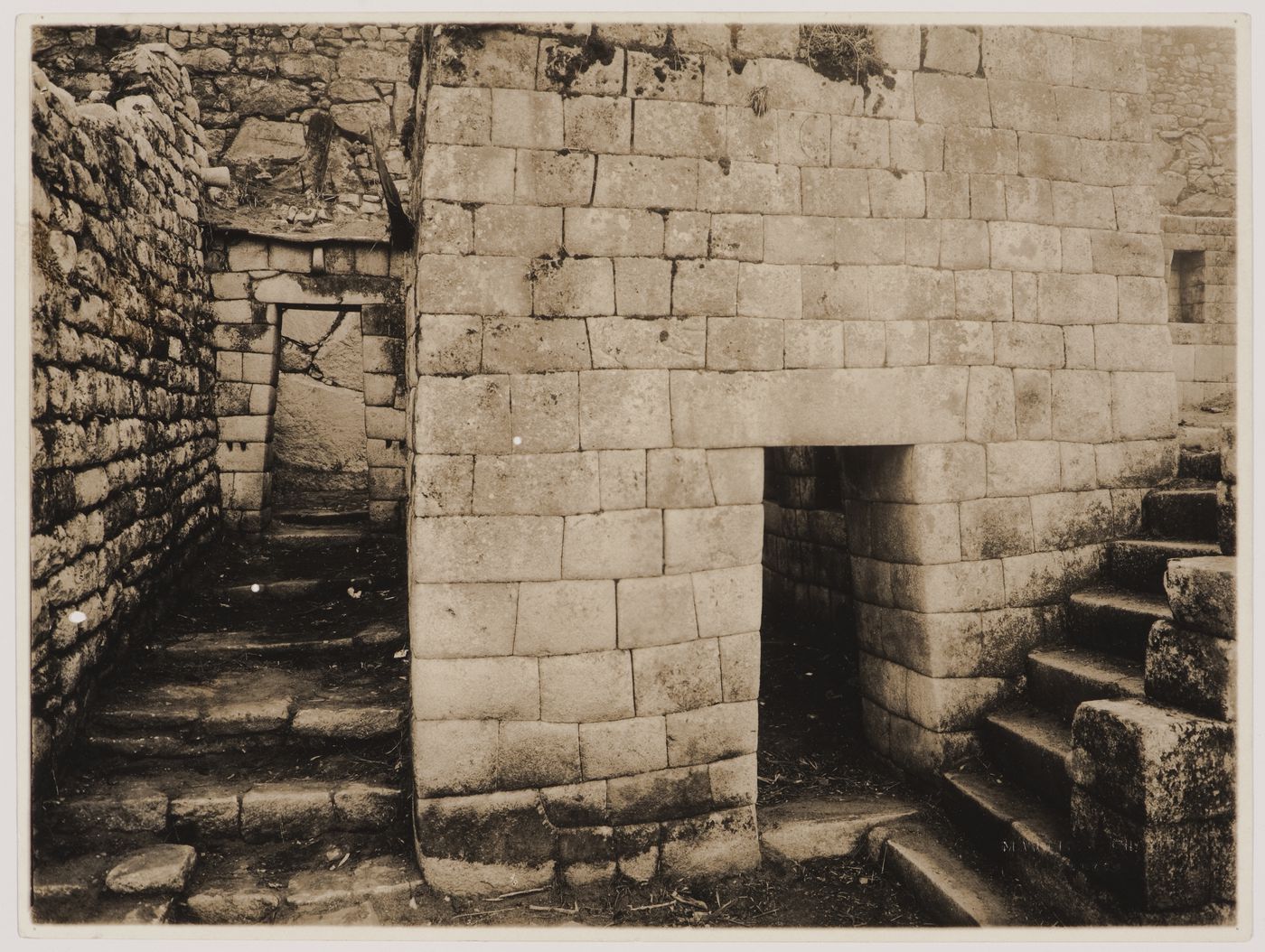 Partial view of the House of Ñusta [princess] showing an alley and entrance on the left and the staircase leading to the Torreón on the right, Machu Picchu, Peru