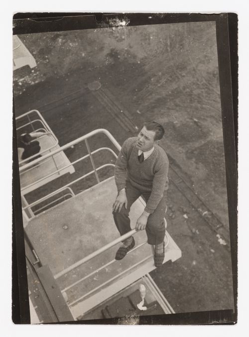 Portrait of Alfred Arndt on a studio balcony at the Bauhaus, Dessau, Germany