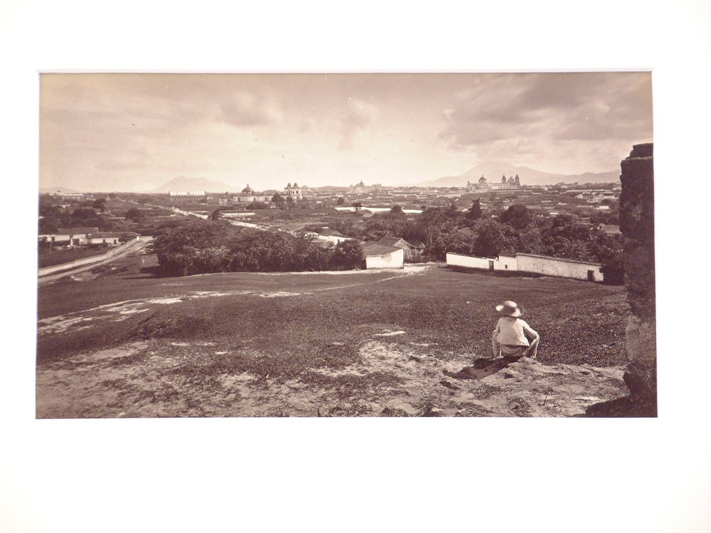 View of City from Cerro del Carmen, with child seated on right, Guatemala City, Guatemala
