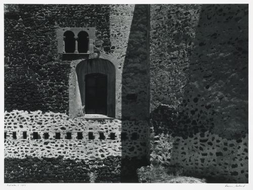 View of windows in a stone wall, possibly the Monastery of San Augustin, Alcoman, Mexico