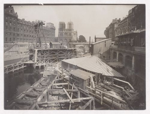 Construction of the Paris Metro, exterior view with the Seine and Notre Dame Cathedral in the background, Paris, France