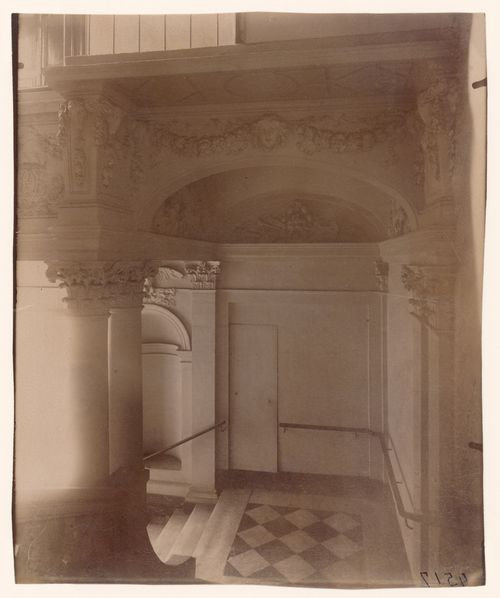 Hôtel de Beauvais: Interior view showing staircase landing and sculptural details on archway above, Paris, France