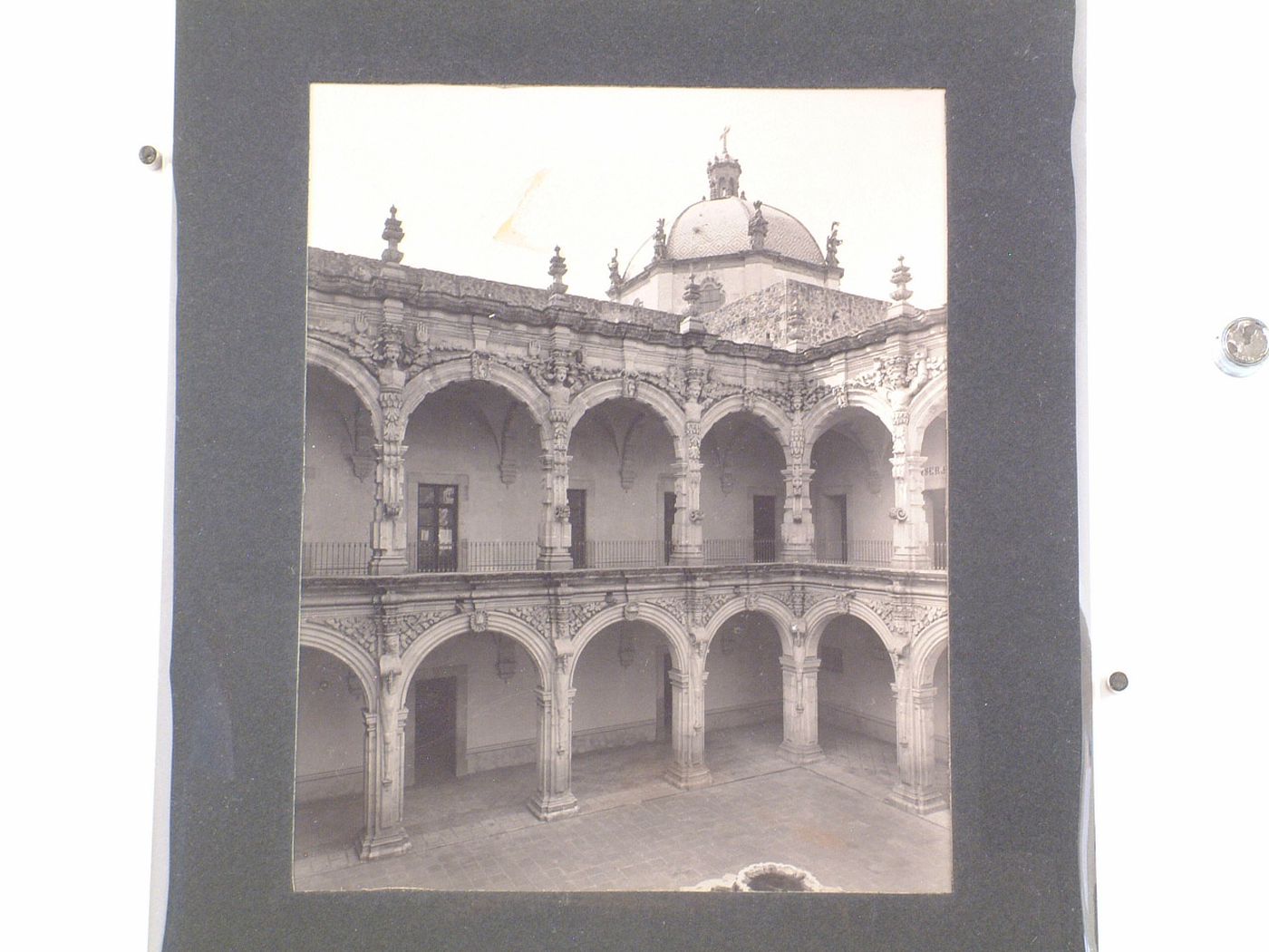 Partial view of the patio and cloister of the Convento de San Agustín with the dome of the Church of San Agustín de Querétaro in the background, Querétaro, Mexico