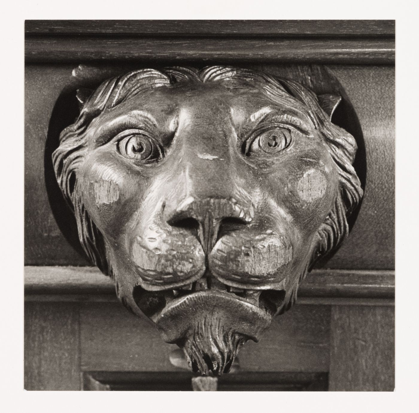 Close-up view of a carved lion head on the wall paneling of the tea room, Shaughnessy House, Montréal, Québec, Canada