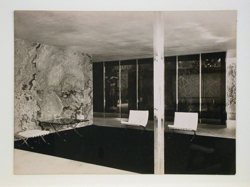 Interior view of the German Pavilion at the Barcelona International Exposition of 1929-1930 showing furniture and a sculpture titled "Der Morgen" [Dawn] by Georg Kolbe, Spain