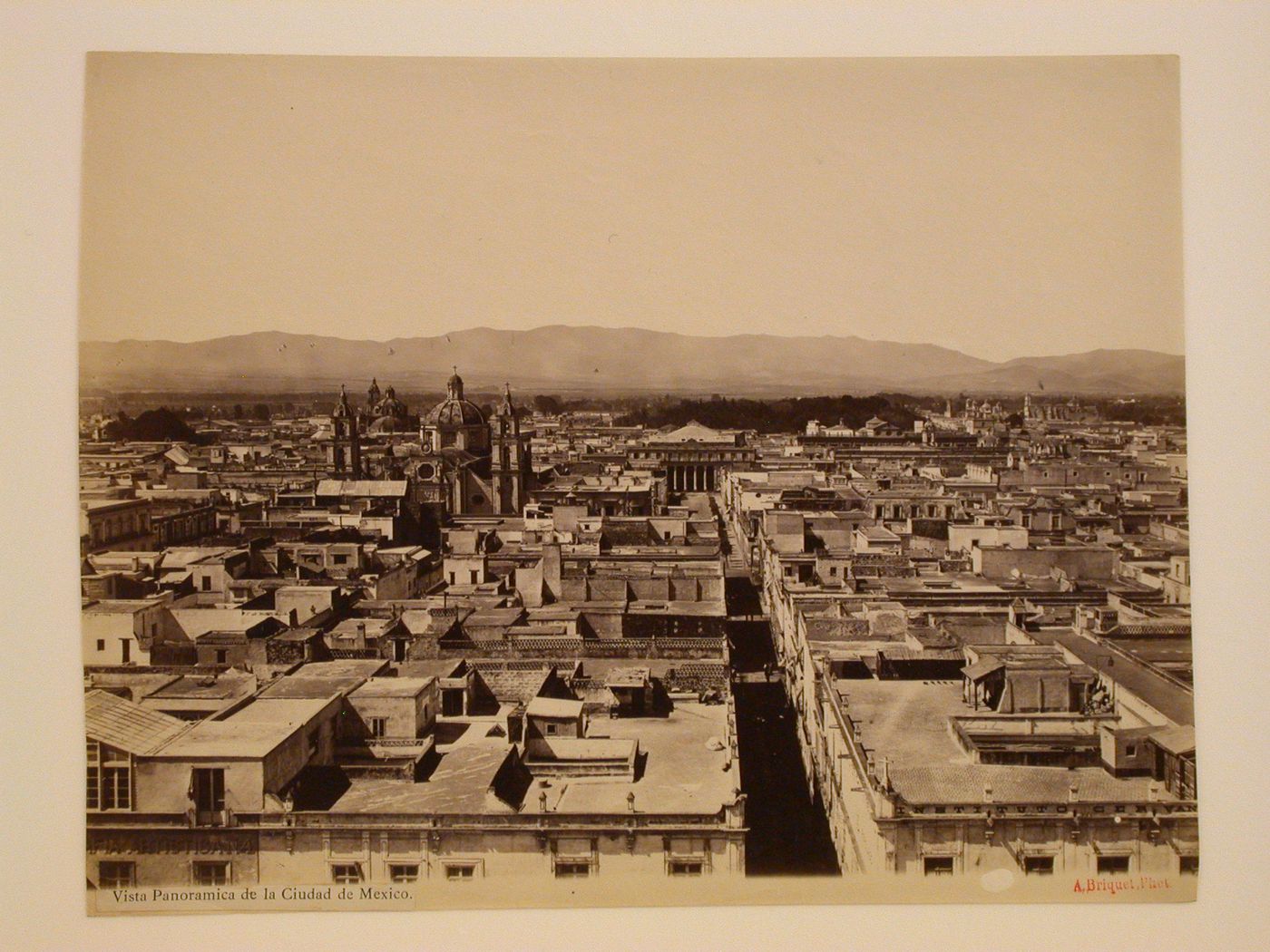 View of Mexico City from the Western tower of the Catedral de México showing the Iglesia de la Casa Profesa and the Church of the Convento de San Francisco on the left and the portico of the Teatro Nacional, with Aquillero Alley in the foreground, Mexico