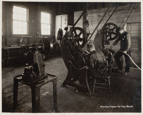 Interior view of workers drawing copper for cap blanks at the Energite Explosives Plant No. 3, the Shell Loading Plant, Renfrew, Ontario, Canada
