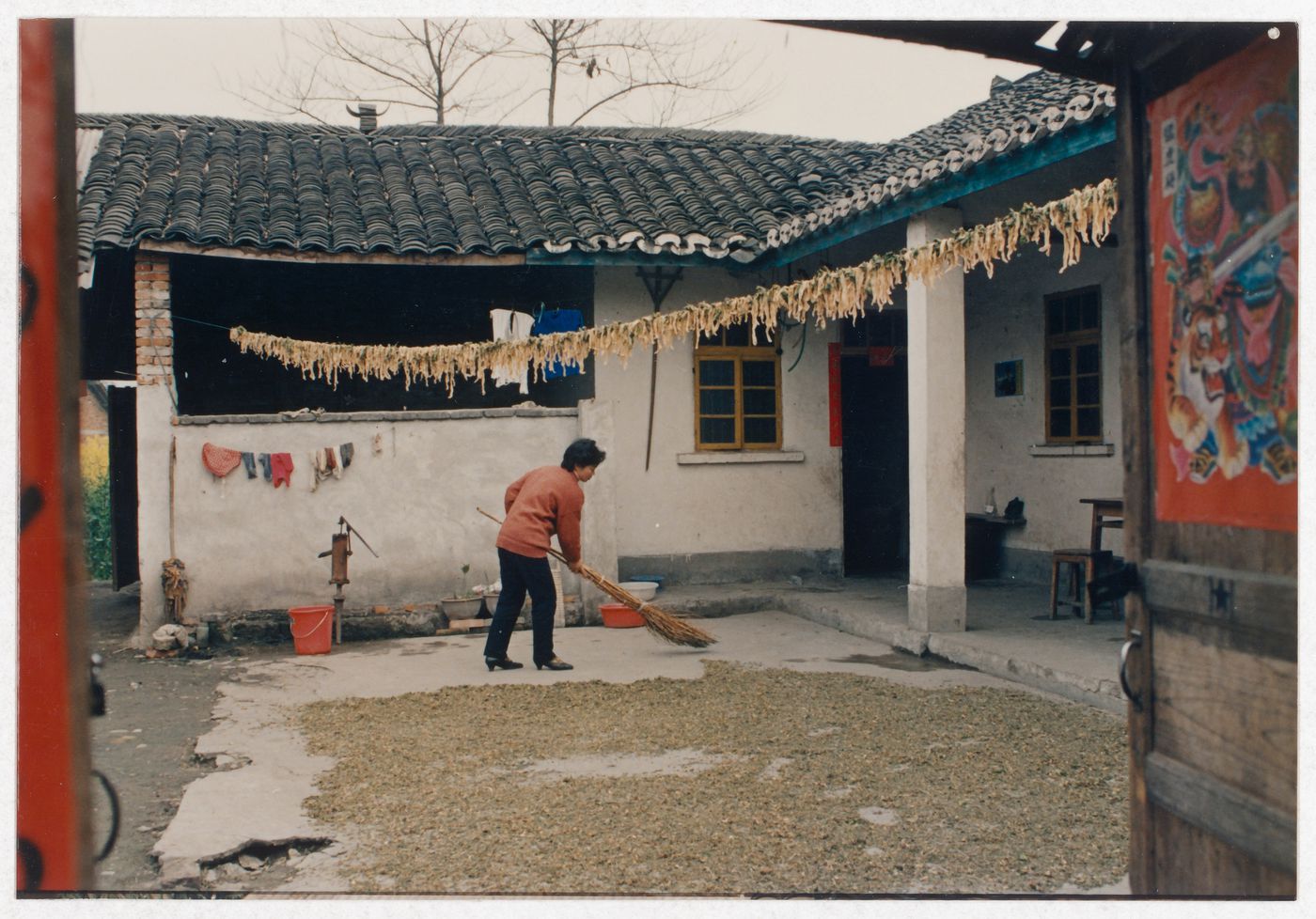 View of rural house interior court and a resident in Sichuan province, China