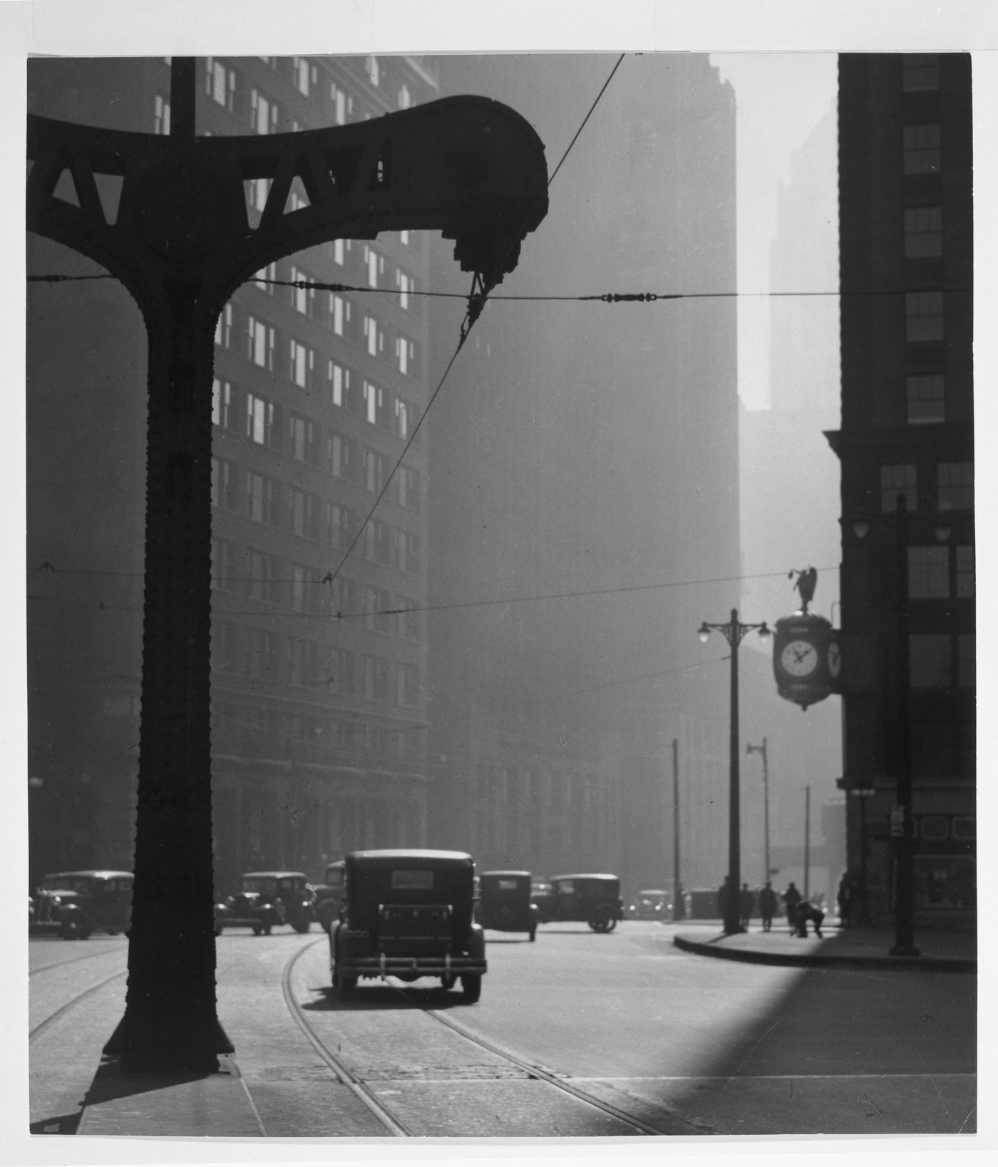 View of intersection with cars, trolley trestle in foreground, Wabash Avenue and Wacker Drive, Chicago, Illinois, United States