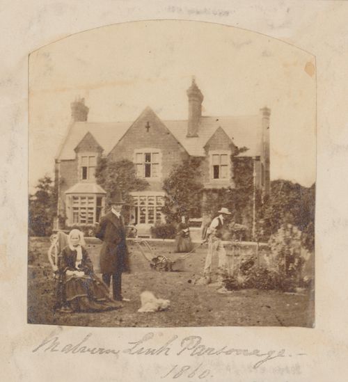 View of a family posing in the front garden of Malvern Link parsonage, Malvern Link, Worchestershire (now Hereford and Worchester), England