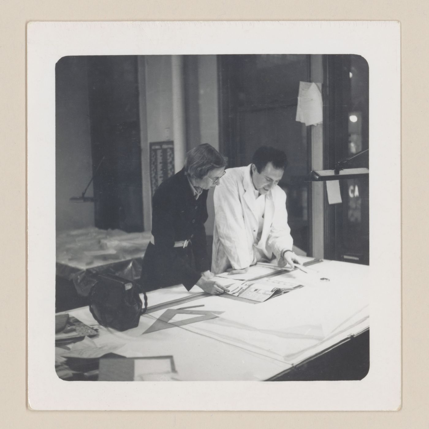 Edith Farnsworth and Myron Goldsmith in the Mies van der Rohe office, Chicago