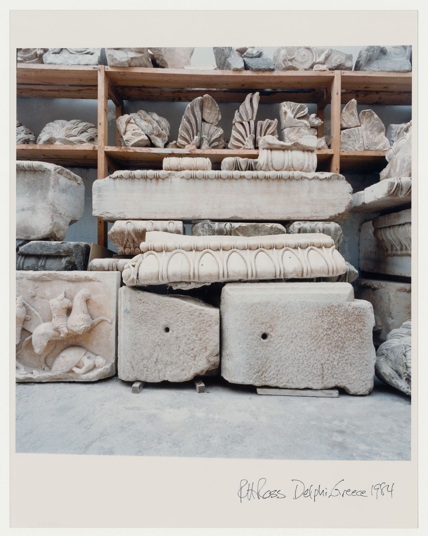 Close-ups of stone fragments in the museum; metope or frieze fragment with warriors in lower left foreground, Delphi, Greece