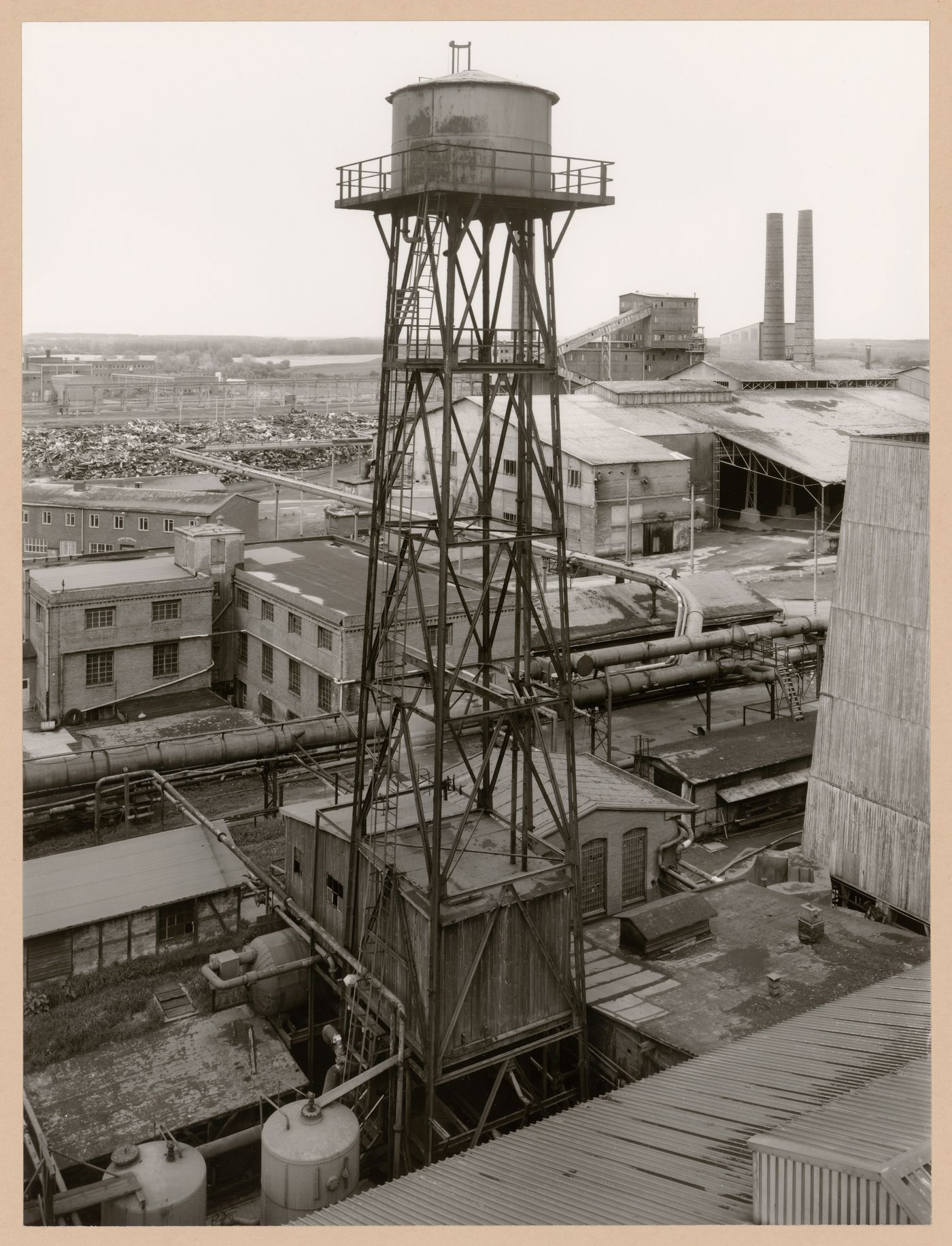 View of Metallhüttenwerk industrial plant showing a water tower, Lübeck-Herrenwyk, Germany