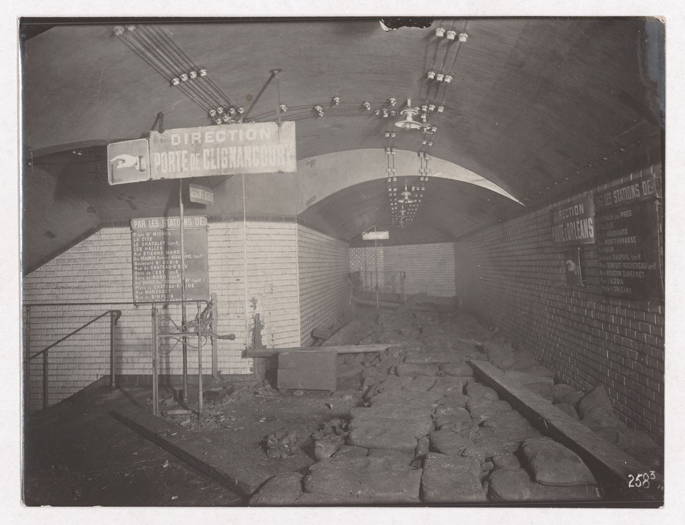 Construction of the Paris Metro, interior view of hallway with signs pointing to the Porte de Clignancourt and Porte d'Orléans stations, Paris, France