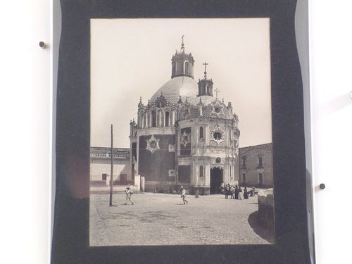 View of the Capilla del Pocito showing a square in the foreground with people throughout, Guadalupe Hidalgo (now Gustavo A. Madero, in Mexico City), Mexico