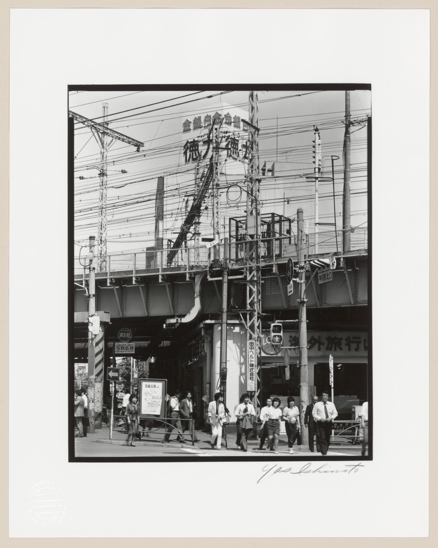 View of an electric railway overpass and pedestrians, Tokyo, Japan