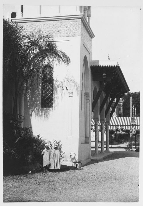View of two children in front of minaret of the Pavillon de l'Algérie, Exposition universelle de 1889, Paris, France