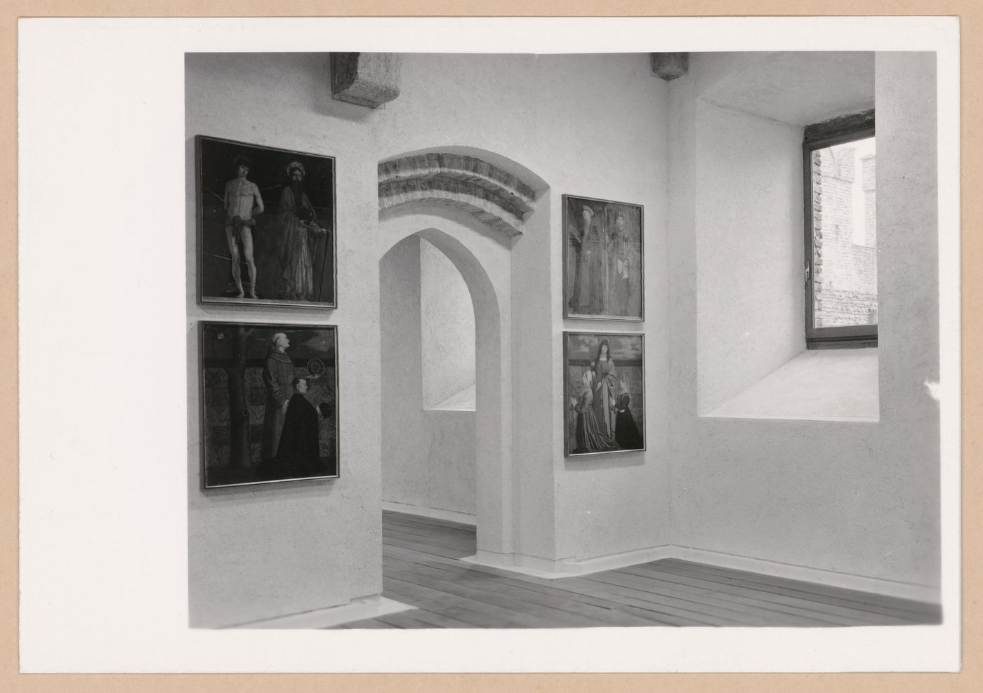 Interior view of a gallery showing paintings, a doorway and a window, Museo di Castelvecchio, Verona, Italy
