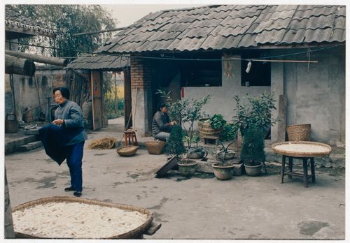View of rural house interior court with its residents in Sichuan province, China