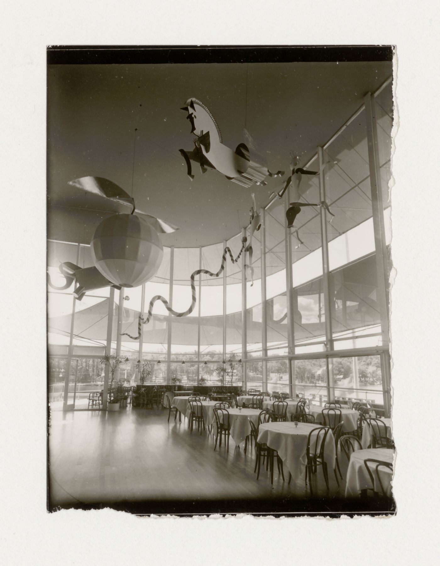 Interior view of the Paradise Restaurant dance hall at the Stockholm Exhibition of 1930 showing ceiling ornaments, tables and chairs, Stockholm