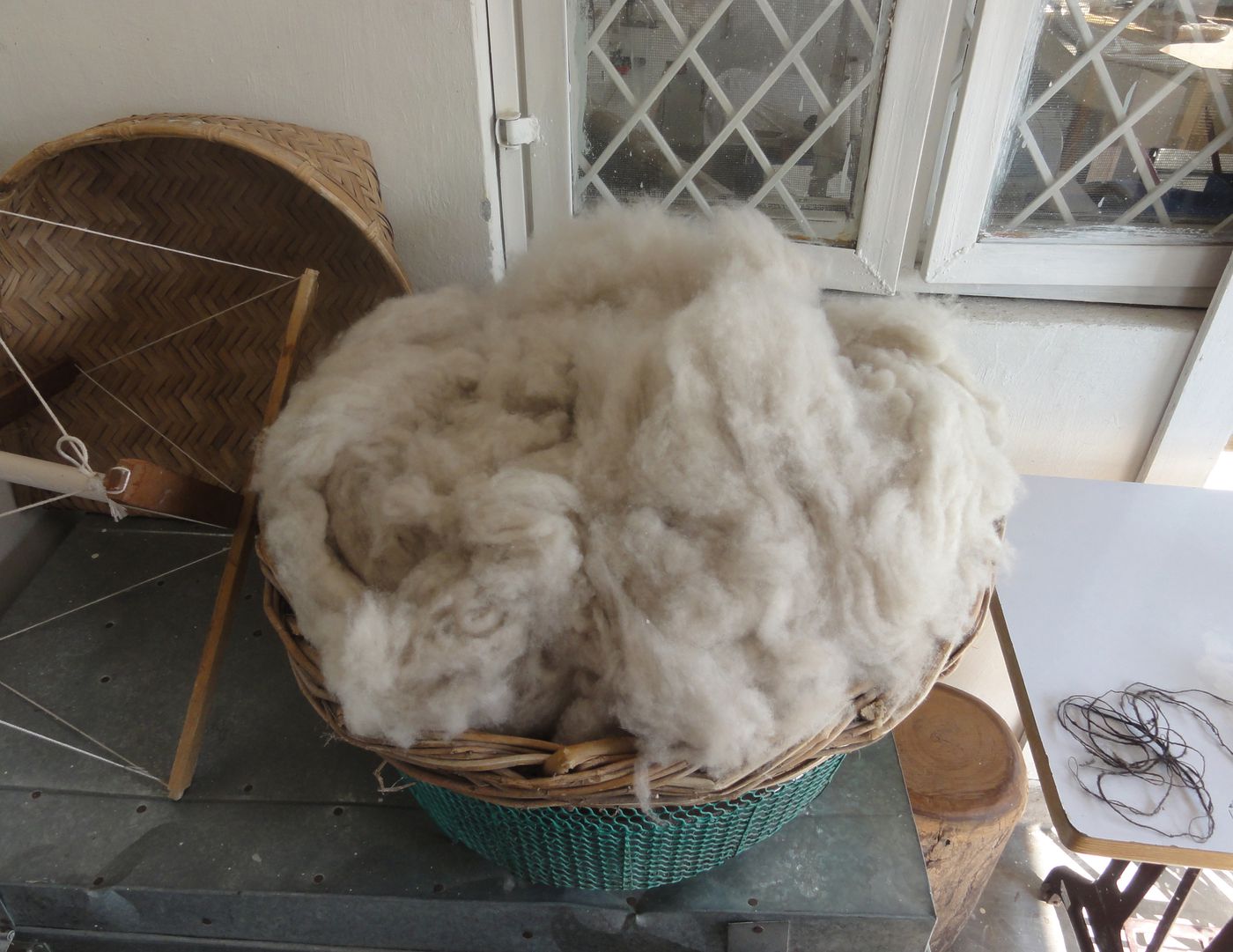Weavers' Studio : basket of raw wool