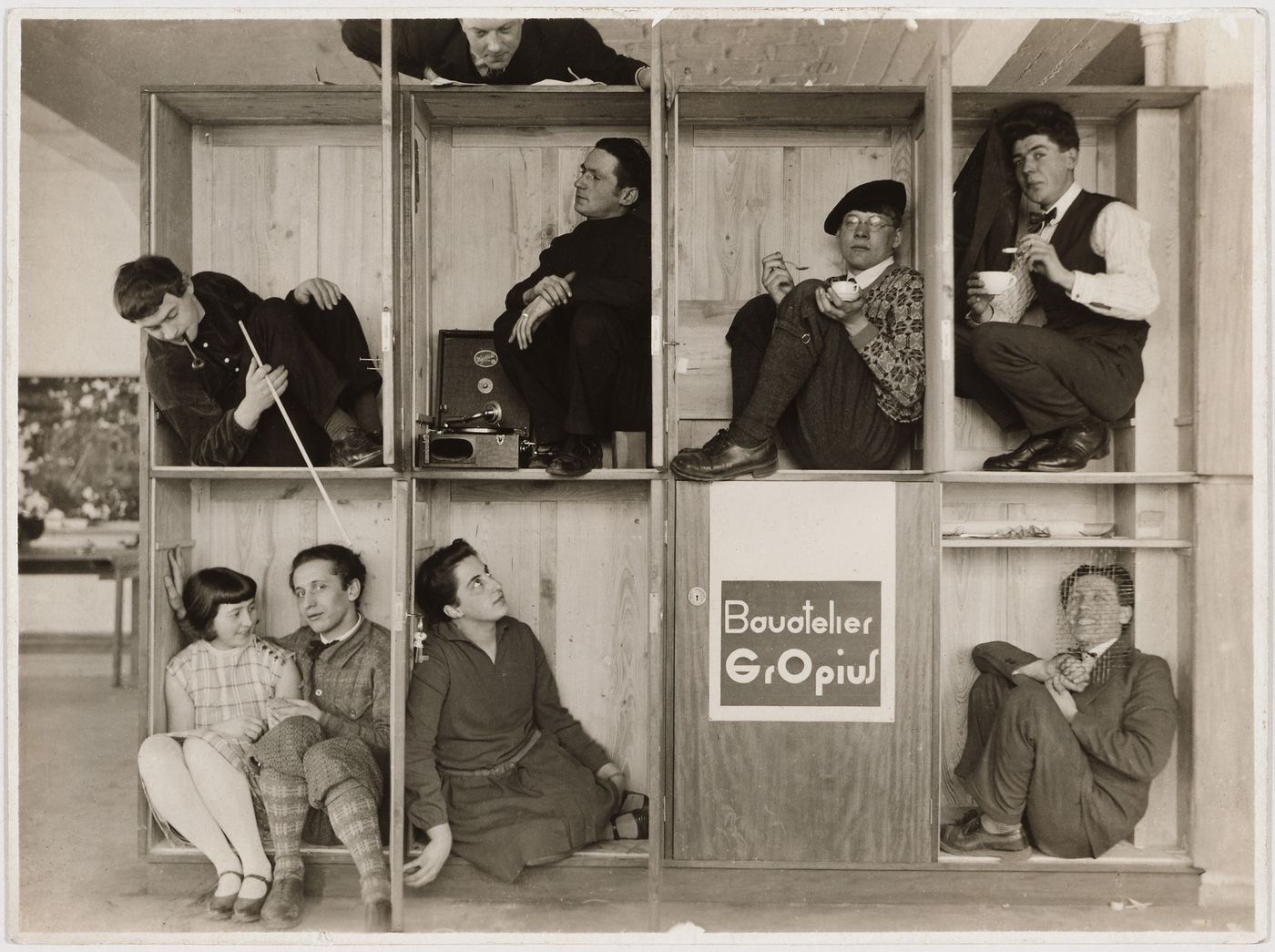 Group portrait of Walter Gropius and his students in Gropius' Bauhaus studio, Dessau, Germany