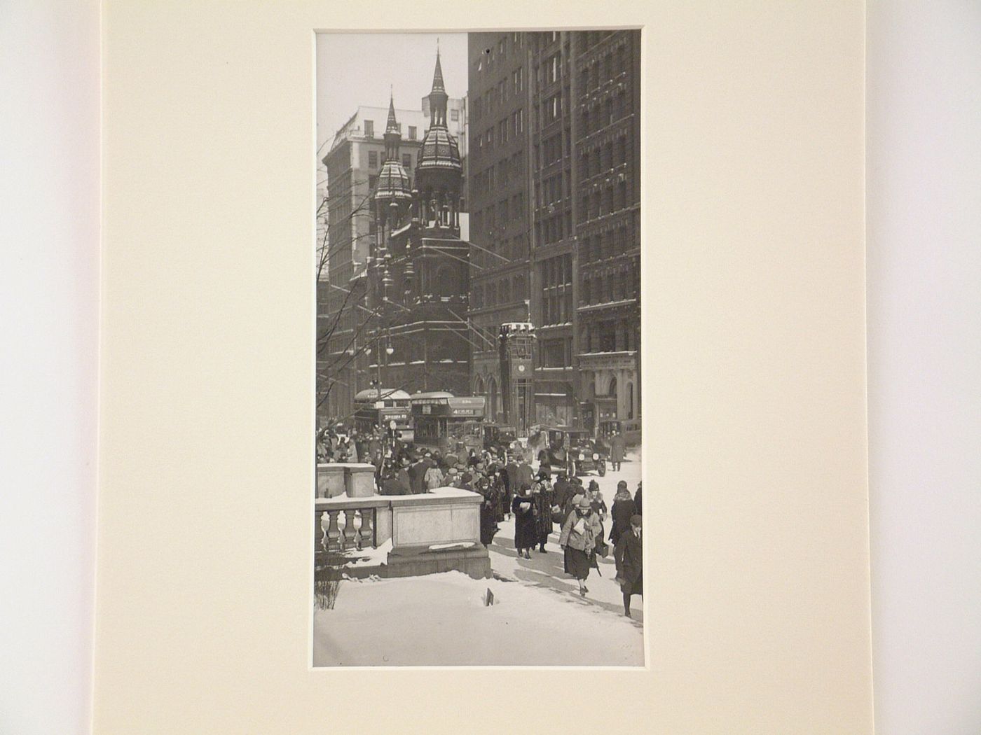 Pedestrians walking in snow on Fifth Avenue, New York City, New York