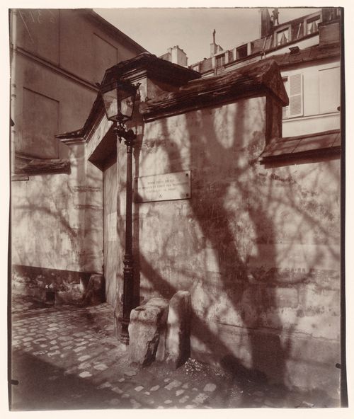 Maison de Balzac, showing front entrance in wall, street lamp and tree shadows, Paris, France