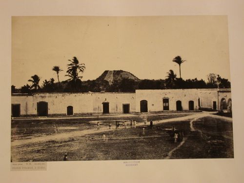 View of a plaza and buildings with the Kinich Kak Mo (also known as the Great Pyramid) in the background, Izamal, Mexico