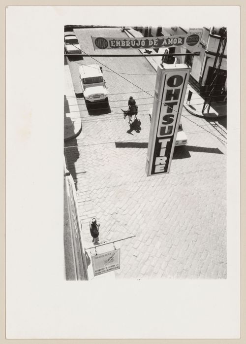 Street scene with sign and donkey, South America