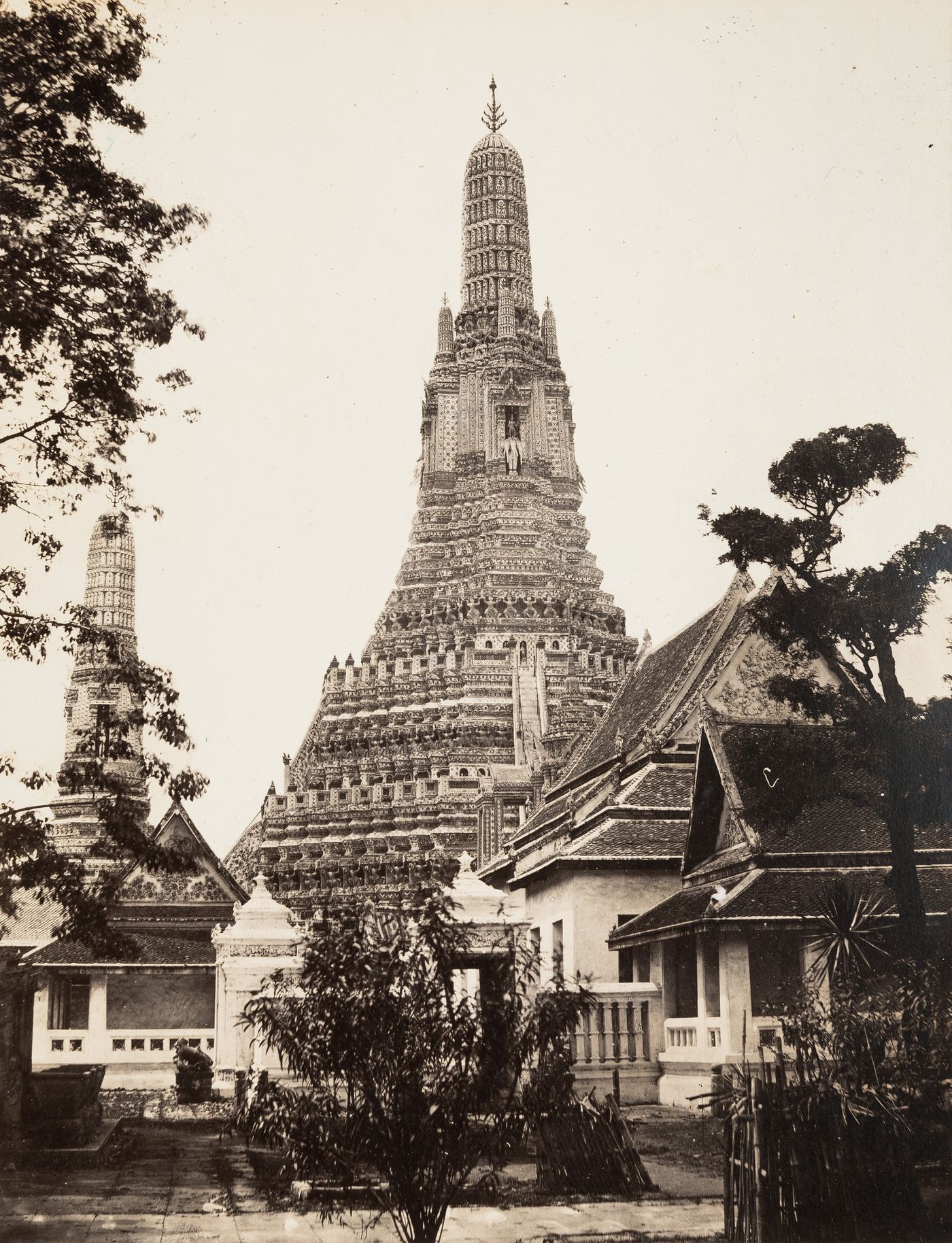 View of the Wat Arun [Temple of the Dawn] and surrounding structures, Bangkok, Thailand)