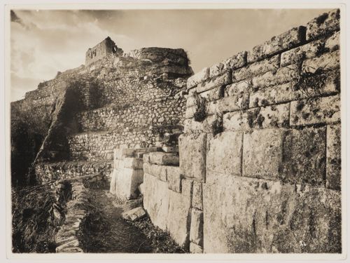 View of Intihuatana Hill and the Little Temple and an exterior wall of the Principal Temple in the right foreground, Sacred Plaza, Machu Picchu, Peru