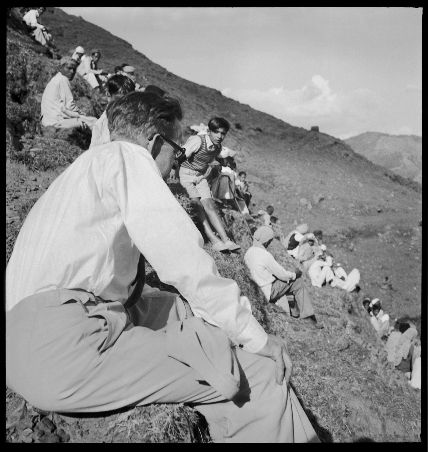 Crowd sitting on a steep hill in Chandigarh's area before the construction, India