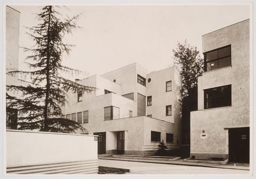 Partial views of Allatini House (no. 3-5) and Dreyfus House (no. 7) from driveway of no. 8 across the street, rue Mallet-Stevens, Auteuil district, Paris, France