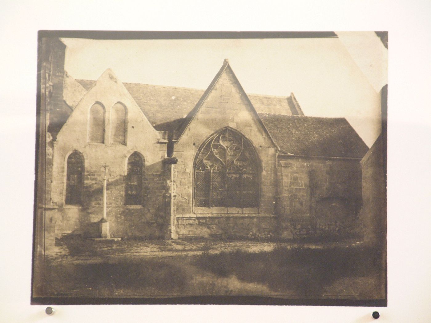 Church façade with large arched gothic window, France ?
